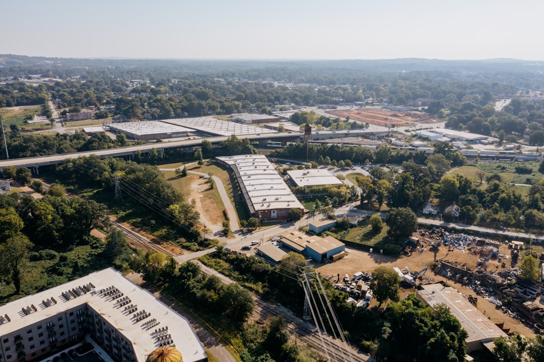 Aerial view of industrial buildings and highway overpass