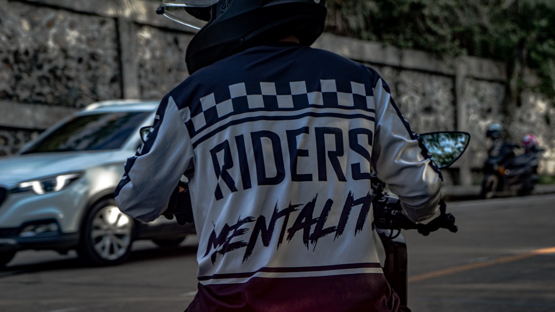 a person riding a motorcycle on a city street